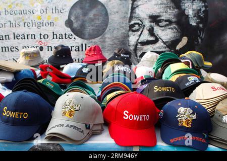 (140506) -- JOHANNESBURG, May 6, 2014 (Xinhua) -- Photo taken on May 6, 2014 shows souvenirs on display in front of a poster of late South African President Nelson Mandela, in Soweto, Johannesburg, South Africa. According to South Africa s Independent Electoral Commission (IEC), more than 25 million have registered to vote for the general elections that will be held on Wednesday. (Xinhua/Li Jing) SOUTH AFRICA-JOHANNESBURG-GENERAL ELECTIONS-PREPARATION PUBLICATIONxNOTxINxCHN   Johannesburg May 6 2014 XINHUA Photo Taken ON May 6 2014 Shows Souvenirs ON Display in Front of a Poster of Late South Stock Photo