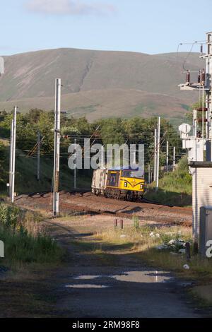 GB Railfreight class 69 diesel locomotive 69001 on the west coast mainline passing Grayrigg loops with a weed killing train Stock Photo