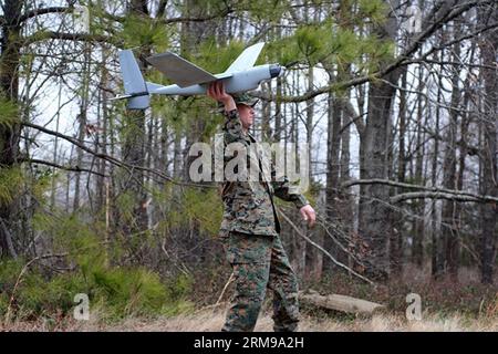 (140515) -- JERUSALEM, May 15, 2014 (Xinhua) -- File photo taken on March 17, 2014 shows a man launching Arrowlite by hand. Israel Aerospace Industries (IAI) on May 13, 2014 unveiled a micro sized-unmanned aerial system developed for American Special Operations forces and counterterrorism units. Hand-launched by a single operator, Arrowlite is a tactical drone that provides small teams with aerial surveillance and reconnaissance of targets. It can be assembled and launched in 60 to 90 seconds after removal from a carry case, and features a payload of day/night thermal cameras, a laser illumina Stock Photo