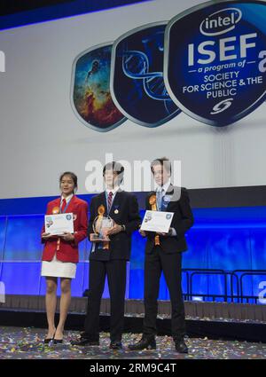 (140517) -- LOS ANGELES,  -- The Gordon E. Moore Award winner Nathan Han (C), Intel Foundation Young Scientist Award winners Lennart Kleinwort (R) and Shannon Lee receive their awards during the award ceremony of Intel International Science and Engineering Fair (Intel ISEF) in Los Angeles, United States, May 16, 2014. Nearly 1,800 of the world s most promising young scientists, engineers and mathematicians gathered in Los Angeles from May 11 to May 16, to participate in the world s largest pre-college science competition, the 2014 Intel International Science and Engineering Fair. (Xinhua/Yang Stock Photo