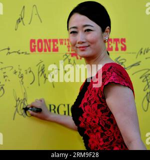 (140521) -- CANNES, (Xinhua) -- Actress Zhao Tao, also wife of jury member, Chinese director Jia Zhangke, poses as she arrives at the red carpet for the screening of the film Gone With The Bullets (Yi Bu Zhi Yao) at the 67th edition of the Cannes Film Festival in Cannes, southern France, on May 20, 2014. (Xinhua/Chen Xiaowei) (zjy) FRANCE-CANNES-FILM FESTIVAL-GONE WITH THE BULLETS-PREMIERE PUBLICATIONxNOTxINxCHN   Cannes XINHUA actress Zhao Tao Thus wife of Jury member Chinese Director Jia Zhangke Poses As She arrives AT The Red Carpet for The Screening of The Film Gone With The Bullets Yi Bu Stock Photo