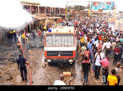 (140521) -- JOS, (Xinhua) -- People gather at the blast site in Jos, Nigeria, May 20, 2014. Death toll of the twin blast on a busy market road in Nigeria s central city of Jos on Tuesday rose to 118, after casualty figures were further collated from various health facilities, an official told reporters here. (Xinhua/Nigeria News Agency) NIGERIA-JOS-BLAST-DEATH TOLL PUBLICATIONxNOTxINxCHN   Jos XINHUA Celebrities gather AT The Blast Site in Jos Nigeria May 20 2014 Death toll of The Twin Blast ON a Busy Market Road in Nigeria S Central City of Jos ON Tuesday Rose to 118 After Casualty Figures We Stock Photo