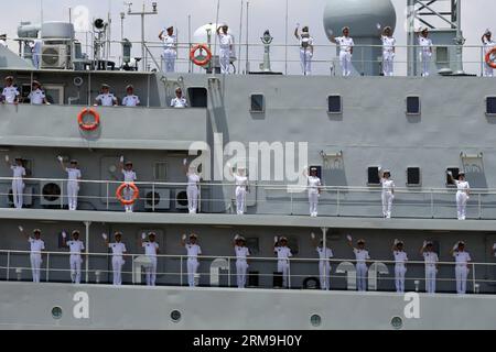 (140523) -- YANGON, May 23, 2014 (Xinhua) -- Chinese Navy soldiers wave on the deck of a Chinese naval vessel at Thilawa Port in Yangon, Myanmar, May 23, 2014. Two Chinese naval ships, Zheng He training vessel and Wei Fang defense vessel, called at the Myanmar International Terminals Thilawa (MITT) in Yangon Friday morning for their second leg of Asian voyage. (Xinhua/U Aung)(zhf) MYANMAR-YANGON-CHINESE NAVY-VISIT PUBLICATIONxNOTxINxCHN   Yangon May 23 2014 XINHUA Chinese Navy Soldiers Wave ON The Deck of a Chinese Naval Vessel AT  Port in Yangon Myanmar May 23 2014 Two Chinese Naval Ships Zhe Stock Photo