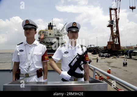 (140523) -- YANGON, May 23, 2014 (Xinhua) -- Chinese Navy soldiers stand on the deck of a Chinese naval vessel at Thilawa Port in Yangon, Myanmar, May 23, 2014. Two Chinese naval ships, Zheng He training vessel and Wei Fang defense vessel, called at the Myanmar International Terminals Thilawa (MITT) in Yangon Friday morning for their second leg of Asian voyage. (Xinhua/U Aung)(zhf) MYANMAR-YANGON-CHINESE NAVY-VISIT PUBLICATIONxNOTxINxCHN   Yangon May 23 2014 XINHUA Chinese Navy Soldiers stand ON The Deck of a Chinese Naval Vessel AT  Port in Yangon Myanmar May 23 2014 Two Chinese Naval Ships Z Stock Photo