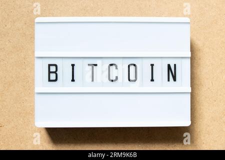 Lightbox with word on wood bit coin background Stock Photo - Alamy