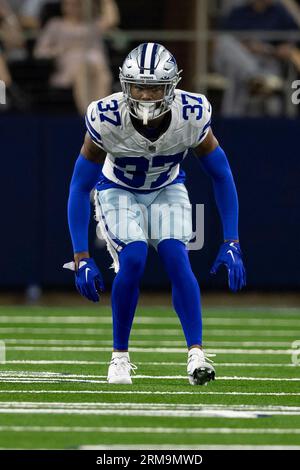 Dallas Cowboys wide receiver Tyron Johnson, left, can't hold on to a pass  while under pressure from cornerback Eric Scott Jr. during the NFL football  team's training camp Monday, July 31, 2023