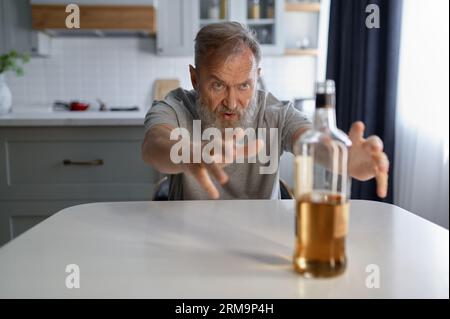 Portrait of senior man suffering from alcoholism Stock Photo