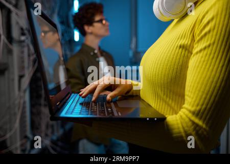 IT technicians working together with network hardware Stock Photo