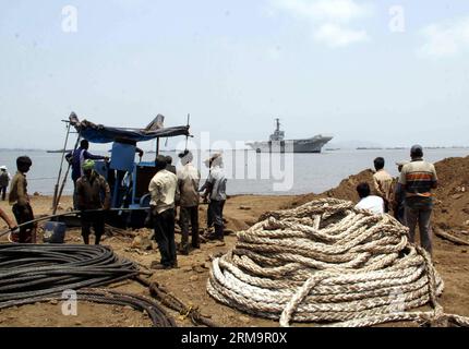 MUMBAI, (Xinhua) -- INS Vikrant, Indian Navy s first aircraft carrier, is seen moved on the Arabian Sea to a ship breaking yard at Reay Road in Mumbai, India, May 29, 2014. (Xinhua/Stringer) INDIA-MUMBAI-INS VIKRANT PUBLICATIONxNOTxINxCHN   Mumbai XINHUA ins Vikrant Indian Navy S First Aircraft Carrier IS Lakes Moved ON The Arabian Sea to a Ship Breaking Yard AT Reay Road in Mumbai India May 29 2014 XINHUA Stringer India Mumbai ins Vikrant PUBLICATIONxNOTxINxCHN Stock Photo