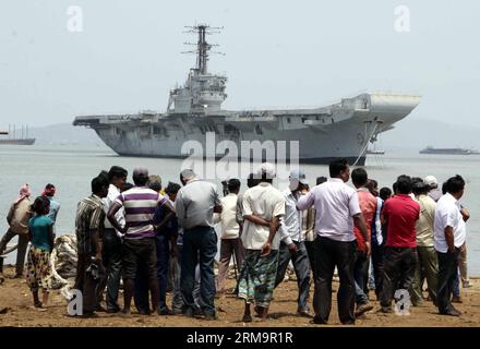 MUMBAI, (Xinhua) -- INS Vikrant, Indian Navy s first aircraft carrier, is seen moved on the Arabian Sea to a ship breaking yard at Reay Road in Mumbai, India, May 29, 2014. (Xinhua/Stringer) INDIA-MUMBAI-INS VIKRANT PUBLICATIONxNOTxINxCHN   Mumbai XINHUA ins Vikrant Indian Navy S First Aircraft Carrier IS Lakes Moved ON The Arabian Sea to a Ship Breaking Yard AT Reay Road in Mumbai India May 29 2014 XINHUA Stringer India Mumbai ins Vikrant PUBLICATIONxNOTxINxCHN Stock Photo