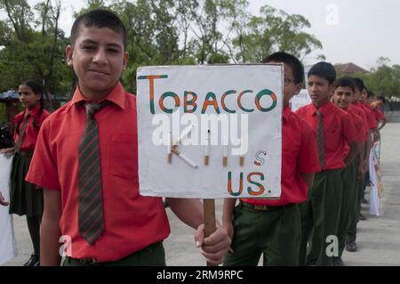 (140531) -- KATHMANDU, May 31, 2014 (Xinhua) -- Students attend a rally marking the World No Tobacco Day in Kathmandu, Nepal, May 31, 2014. The World Health Organization (WHO) has called for countries to raise taxes on tobacco to encourage users to stop and prevent other people from becoming addicted to tobacco. (Xinhua/Pratap Thapa) NEPAL-KATHMANDU-WORLD NO TOBACCO DAY PUBLICATIONxNOTxINxCHN   Kathmandu May 31 2014 XINHUA Students attend a Rally marking The World No Tobacco Day in Kathmandu Nepal May 31 2014 The World Health Organization Who has called for Countries to Raise Taxes ON Tobacco Stock Photo