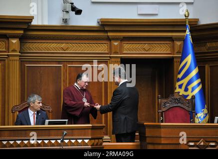 (140607) -- KIEV, June 7, 2014 (Xinhua) -- Ukrainian President Petro Poroshenko receives the certificate of president during his inauguration ceremony in Kiev, Ukraine, June 7, 2014. Petro Poroshenko was sworn in on Saturday as the fifth Ukrainian president at an inauguration ceremony in Kiev. (Xinhua/Ukrainian Presidential Office/Pool) (dzl) UKRAINE-KIEV-PRESIDENT-INAUGURATION CEREMONY PUBLICATIONxNOTxINxCHN   Kiev June 7 2014 XINHUA Ukrainian President Petro Poroshenko receives The Certificate of President during His Inauguration Ceremony in Kiev Ukraine June 7 2014 Petro Poroshenko what  in Stock Photo