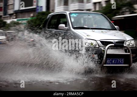 (140618) -- QUANZHOU, June 18, 2014 (Xinhua) -- A motorcar runs on a flooded road in Quanzhou County of Guilin City, south China s Guangxi Zhuang Autonomous Region, June 18, 2014. A rainstorm hit seven counties and cities of Guilin on Wednesday. (Xinhua/Wang Zichuang) (lfj) CHINA-GUANGXI-GUILIN-WATERLOGGING (CN) PUBLICATIONxNOTxINxCHN   Quanzhou June 18 2014 XINHUA a motorcar runs ON a flooded Road in Quanzhou County of Guilin City South China S Guangxi Zhuang Autonomous Region June 18 2014 a Rainstorm Hit Seven Counties and CITIES of Guilin ON Wednesday XINHUA Wang Zichuang  China Guangxi Gui Stock Photo