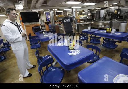 Crew members take a break inside the USS Decatur in Vancouver, Canada, June 19, 2014. United States Ship (USS) Decatur arrives the port of Vancouver for a five-day visit. During the visit, Vancouver residents are allowed to go on board and tour around the ship. The ship commissioned on August 29, 1998 which is one of the 18 US navy ship that equipped with Aegis Ballistic Missile Defense System. (Xinhua/Liang Sen)(ctt) CANADA-VANCOUVER-USS DECATUR PUBLICATIONxNOTxINxCHN   Crew Members Take a Break Inside The USS Decatur in Vancouver Canada June 19 2014 United States Ship USS Decatur arrives The Stock Photo