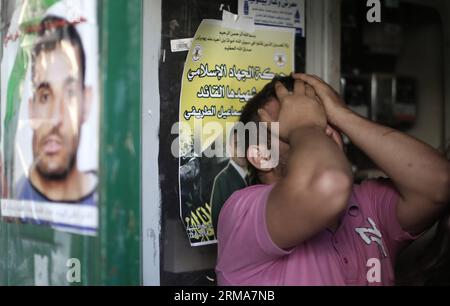 RAMALLAH, June 22, 2014 (Xinhua) - A relative mourns at the funeral of Mahmoud Ismail in the West Bank city of Ramallah, June 22, 2014. The medical sources confirmed that Mahmoud Ismail, 36 years old, was shot dead by Israeli soldiers during clashes in the city. The large-scale Israeli military operation in the West Bank to search three missing teenagers continues as the Palestinians decided on Sunday to approach the UN Security council to put an end to the offensive. (Xinhua/Fadi Arouri) (zjy) MIDEAST-RAMALLAH-FUNERAL PUBLICATIONxNOTxINxCHN   Ramallah June 22 2014 XINHUA a relative  AT The Fu Stock Photo