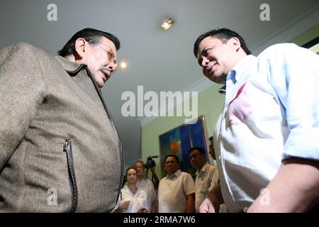 (140623) -- SAN JUAN CITY, June 23, 2014 (Xinhua) -- Philippine Senator Jinggoy Estrada (R) talks with his father, former President and current Mayor of Manila Joseph Estrada, at their home in San Juan City, the Philippines, June 23, 2014. Jinggoy Estrada surrendered to the Philippine anti-graft court to face plunder charges for the misuse of government funds. (Xinhua/Rouelle Umali) PHILIPPINES-SAN JUAN CITY-SENATOR-SURRENDER PUBLICATIONxNOTxINxCHN   San Juan City June 23 2014 XINHUA Philippine Senator  Estrada r Talks With His Father Former President and Current Mayor of Manila Joseph Estrada Stock Photo