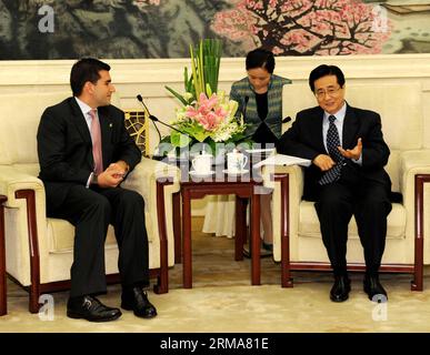 (140623) -- BEIJING, June 23, 2014 (Xinhua) -- Zhao Hongzhu (R), member of the Secretariat of the Communist Party of China (CPC) Central Committee, meets with a Colombian delegation led by Juan Carlos Wills (L), secretary-general of the Colombian Conservative Party, in Beijing, China, June 23, 2014. (Xinhua/Rao Aimin) (hdt) CHINA-BEIJING-ZHAO HONGZHU-COLOMBIAN-MEETING (CN) PUBLICATIONxNOTxINxCHN   Beijing June 23 2014 XINHUA Zhao  r member of The Secretariat of The Communist Party of China CPC Central Committee Meets With a Colombian Delegation Led by Juan Carlos Wills l Secretary General of T Stock Photo