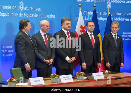 (140627) -- BRUSSELS, June 27, 2014 (Xinhua) -- (from L to R)European Union (EU) Commission President Jose Manuel Barosso, EU Council President Herman Van Rompuy, Ukrainian President Petro Poroshenko, Georgian Prime Minister Irakli Garibashvili and Moldova s Prime MInister Iurie Leanca are present at the signing ceremony, in Brussels, Belgium, June 27, 2014. The European Union (EU) signed the Association Agreements with Ukraine, Georgia and Moldova on Friday with the aim of deepening political and economic ties with the three former Soviet republics(Xinhua/The Council of the European Union) (l Stock Photo