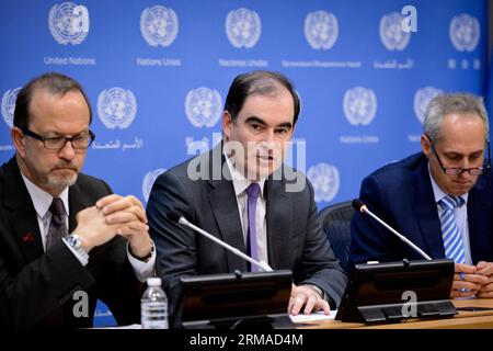 (140703) -- New York, July 2, 2014 (Xinhua) -- John Ging (C), operations director for the UN Office for the Coordination of Humanitarian Affairs (OCHA), speaks during a press briefing at the United Nations headquarters in New York, on July 2, 2014. Yemen, reeling from political instability and insecurity from jihadist attacks, is on the brink of an economic collapse, Ging said here Wednesday, blaming the mild, but popular, drug khat for much of the Aden Gulf nation s woes. (Xinhua/Niu Xiaolei) UN-NEW YORK-YEMEN-BRIEFING PUBLICATIONxNOTxINxCHN   New York July 2 2014 XINHUA John went C Operation Stock Photo