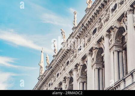 Architecture detail with the facade of the Marciana National Library (Biblioteca nazionale Marciana) located in Palazzo della Libreria in Venice. Stock Photo