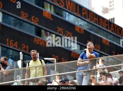 (140703) -- NEW YORK, July 3, 2014 (Xinhua) -- Tourists gather in front of the screens which shows the Dow Jones Industrial Index at the New York s Time Square in New York, the United States on July 3, 2014. U.S. stocks closed at record highs Thursday to end a holiday shortened week, with the Dow Jones Industrial Average settling above 17,000 points for the first time, boosted by stronger-than-expected U.S. nonfarm payroll report. (Xinhua/Wang Lei) U.S.-NEW YORK-DOW JONES-HIGH PUBLICATIONxNOTxINxCHN   New York July 3 2014 XINHUA tourists gather in Front of The Screens Which Shows The Dow Jones Stock Photo