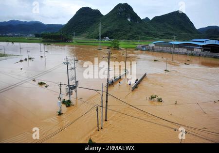 (140705) -- MASHAN, July 5, 2014 (Xinhua) -- This bird eye view shows a flooded area in Mashan County, south China s Guangxi Zhuang Autonomous Region, July 5, 2014. Torrential rain hit Guangxi since July 4, where the precipitation exceeded 100 mm in 21 counties. (Xinhua/Zhang Ailin) (hdt) CHINA-GUANGXI-RAIN (CN) PUBLICATIONxNOTxINxCHN   Mashan July 5 2014 XINHUA This Bird Eye View Shows a flooded Area in Mashan County South China S Guangxi Zhuang Autonomous Region July 5 2014 torrential Rain Hit Guangxi Since July 4 Where The precipitation exceeded 100 MM in 21 Counties XINHUA Zhang Ailin HDT Stock Photo