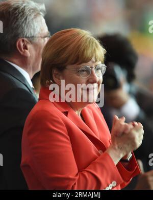 (140713) -- RIO DE JANEIRO, July 13, 2014 (Xinhua) -- German Chancellor Angela Merkel celebrates after Germany s Mario Götze scores during the final match between Germany and Argentina of 2014 FIFA World Cup at the Estadio do Maracana Stadium in Rio de Janeiro, Brazil, on July 13, 2014. Germany won 1-0 over Argentina after 120 minutes and took its fourth World Cup title on Sunday. (Xinhua/Li Ga)(pcy) (SP)BRAZIL-RIO DE JANEIRO-WORLD CUP 2014-FINAL-GERMANY VS ARGENTINA PUBLICATIONxNOTxINxCHN   Rio de Janeiro July 13 2014 XINHUA German Chancellor Angela Merkel celebrates After Germany S Mario Göt Stock Photo