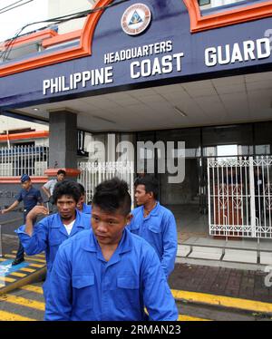 (140717) -- MANILA, July 17, 2014 (Xinhua) -- Rescued Filipino fishermen exit the Philippine Coast Guard (PCG) Headquarters in Manila, the Philippines, on July 17, 2014. The crew of Chinese vessel MV Pacific Pioneer, which came from Hong Kong of China, rescued the four Filipino fishermen who were in the sea for two days after their vessel was submerged in the strong wind brought by typhoon Rammasun. (Xinhua/Rouelle Umali) PHILIPPINES-MANILA-RESCUED FISHERMEN PUBLICATIONxNOTxINxCHN   Manila July 17 2014 XINHUA Rescued Filipino Fishermen Exit The Philippine Coast Guard PCG Headquarters in Manila Stock Photo