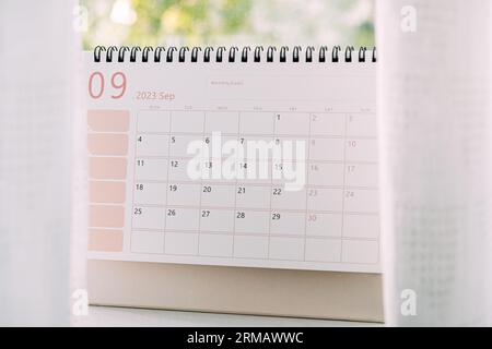 Desk September 2023 Calendar. 2023 September desk calendar or planner weeks on home window background. Start September planning Stock Photo
