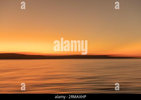 Abstract waves, orange gradient background. Stock Photo