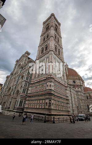 The 84.7 meters (277.9 feet) tall Giotto's Campanile (Giotto’s bell tower) standing next to the of the Santa Maria del Fiore, (Florence Cathedral) on Stock Photo
