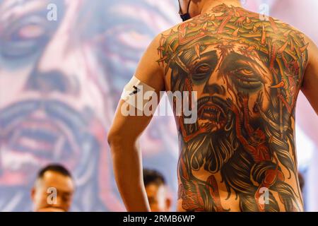People Make a Tattoos at the 10-th International Tattoo Convention in the  Congress-EXPO Center. Editorial Photo - Image of artist, piercing: 56249916