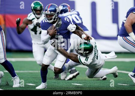 New York Jets linebacker Jermaine Johnson (52) warms up before playing  against the Buffalo Bills in