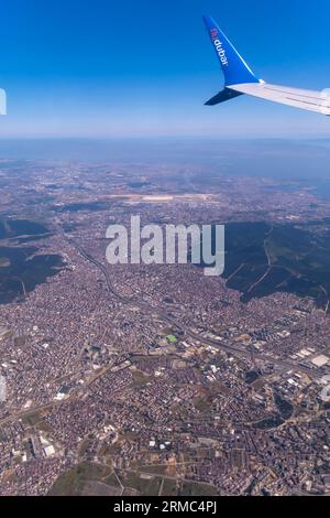 Istanbul Turkey out of airplane window, aircraft wing FlyDubai airline - aerial view from an airplane window seat Stock Photo