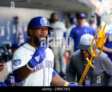 Seattle Mariners Vs. New York Mets Seattle Mariners Teoscar Hernandez 35 is  handed the trident