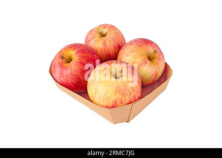 Four red striped apple fruits in the brown recycled paper tray isolated on white. Stock Photo