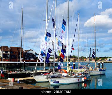 27 August 2023, MDL Ocean Village Marina , Southampton Hampshire UK Five of the 14 contestants entered for the Ocean Globe Race assembling at MDL Ocean Village Marina, Southampton preparing to celebrate the 50th anniversary of the iconic Whitbread Round the World Race. The fully crewed Ocean Globe Race is being run in the spirit of the original 1973 race with no assistance nor use of modern technology. The 27,000 mile three stopovers race via Cape Town, Auckland, and Punta del Este will start at 1300 on 10 Sept 2023 from the Royal Yacht Squadron , Cowes, Isle of Wight. Credit Gary Blake/Alamy Stock Photo