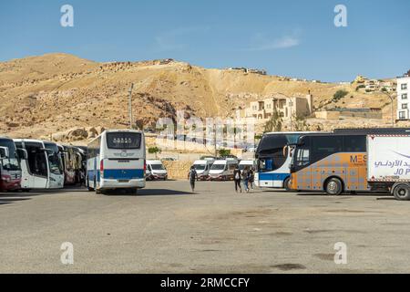 Bus stop in Petra Jordan with buses arriving and departing to destinations in Jordan Stock Photo