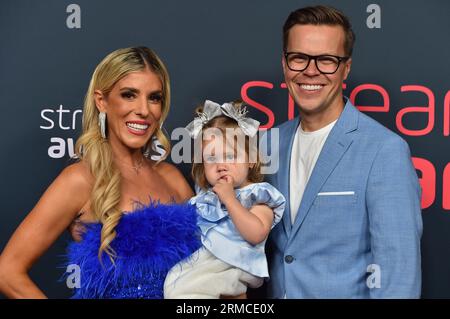 Rebecca Zamolo, from left, Zadie Zamolo and Matt Slays arrive at the