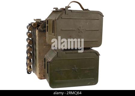 Ammo box with ammunition belt and 14.5mm cartridges for a 14.5mm KPVT heavy machine gun used by the former Soviet Union. Isolated on white background. Stock Photo