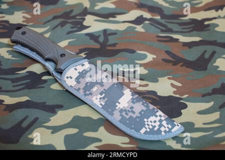 Tactical Blade Combat Hunting Survival Knife Set On Camouflage Cloth In Background Stock Photo