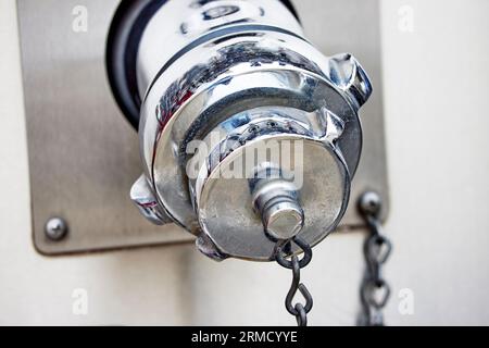 Close up of a Fire Hose Adapter Fitting mounted on a Fire Truck Stock Photo