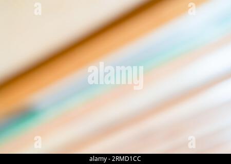 Background of blurred lines of warm brown tone in the background. abstract wallpaper Stock Photo