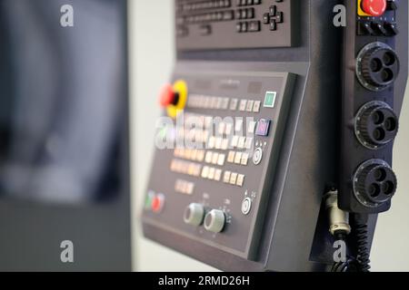 Control panel  and manual handwheel control unit of 5 axis CNC machining center. Selective focus. Stock Photo
