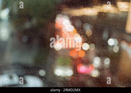 Rain drops on the window with view of traffic jam Stock Photo