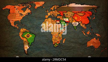 BRICS member countries and candidates flags on political world map with national borders Stock Photo