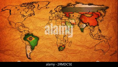 BRICS member countries and candidates flags on political world map with national borders Stock Photo