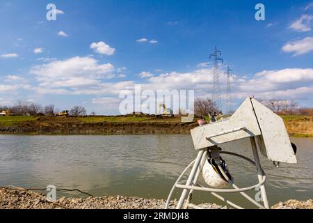 Industrial remote with joysticks, wireless, console to control tower drilling machine, big equipment to drill into the ground, for bridge foundation o Stock Photo