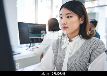 Programming, developer and computer with business woman in office for coding, software and information technology. Database, website and research with Stock Photo