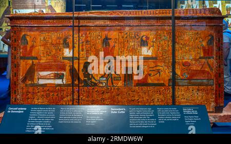 Paris, France - 08 22 2023: Ramses II the Great, Gold of the Pharaohs. Outer coffin of Sennedjem, with lid, on a wooden sledge Stock Photo